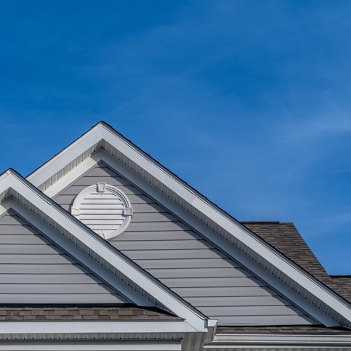 a shingle roof with two gables