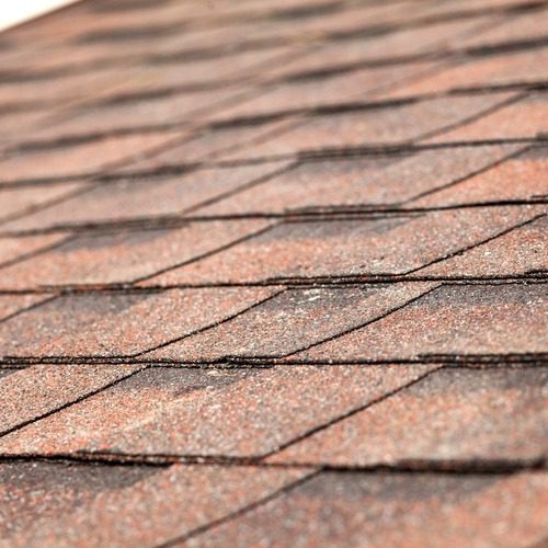 close-up of a roof with new asphalt shingles