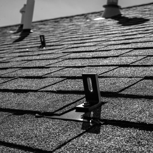 gray shingle roof with metal anchors