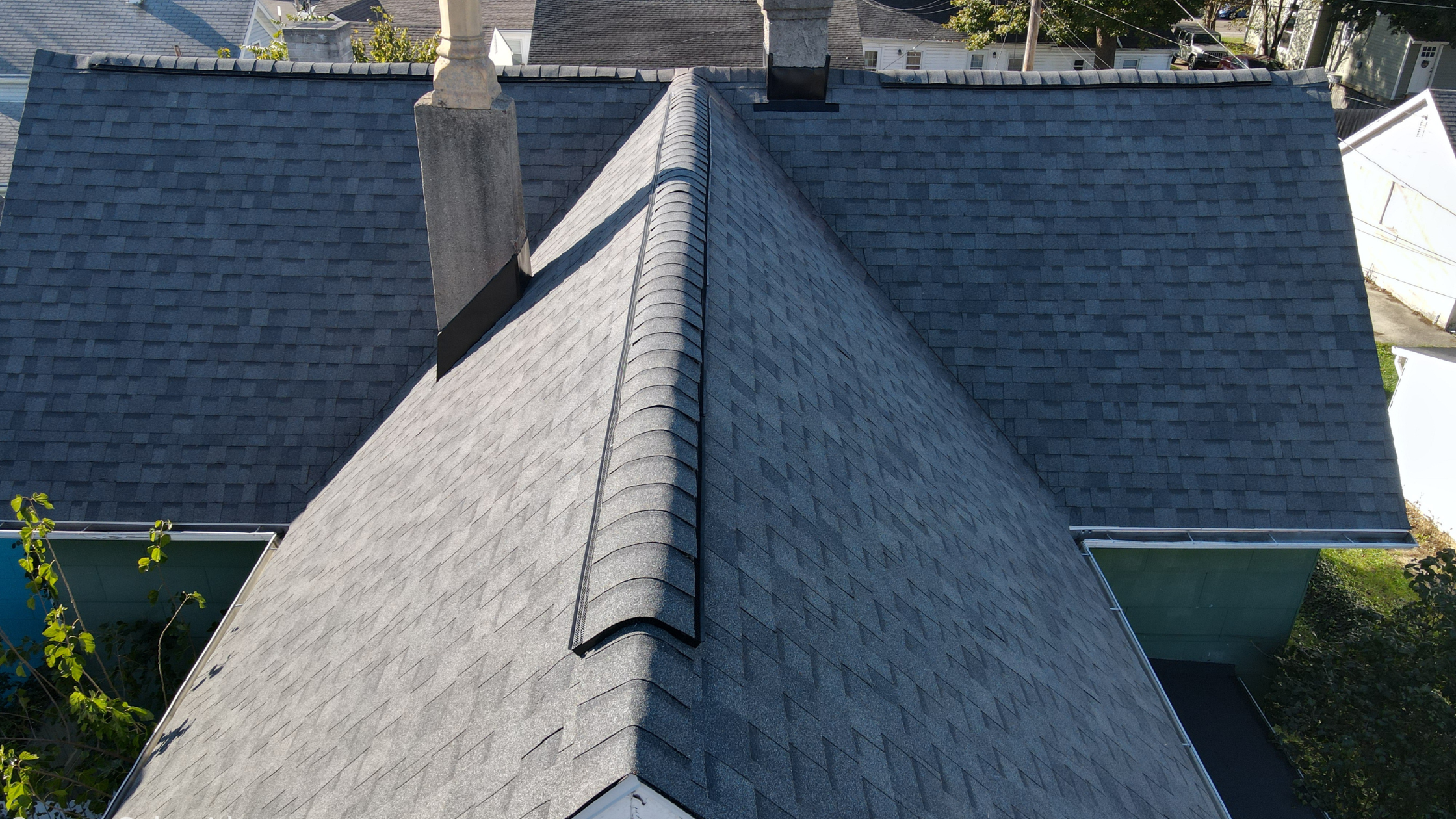 Roof color reduces heat Residential roof installation crew in action