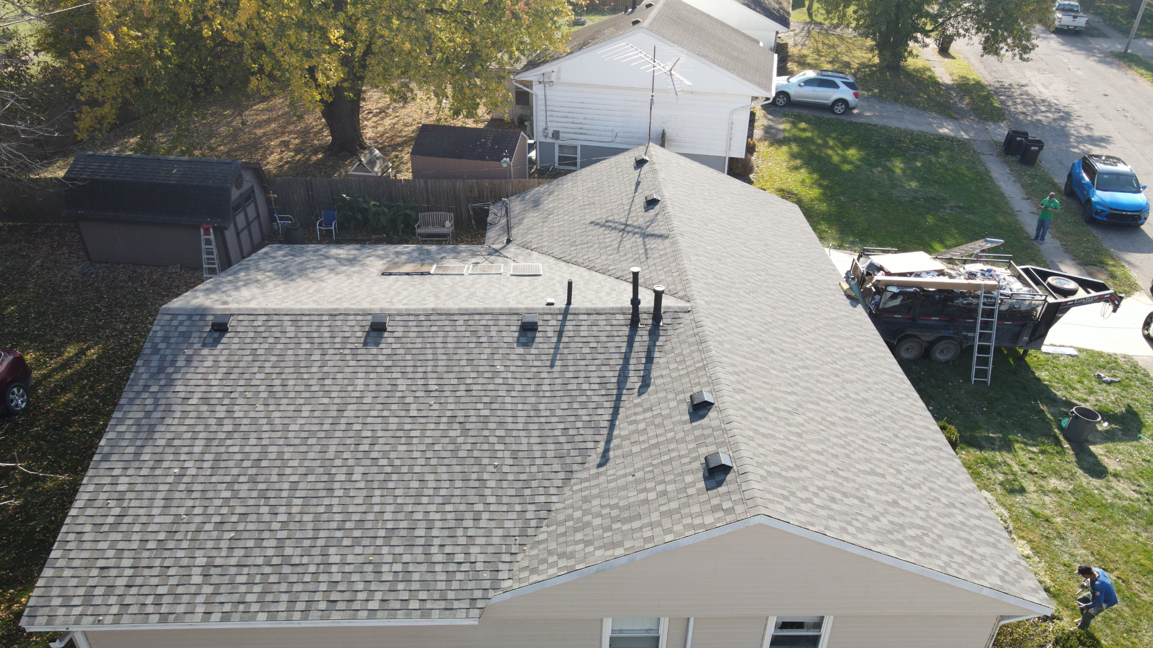 cost to roof a 3 bedroom Aerial view of a finished roofing job near Beavercreek shopping plaza