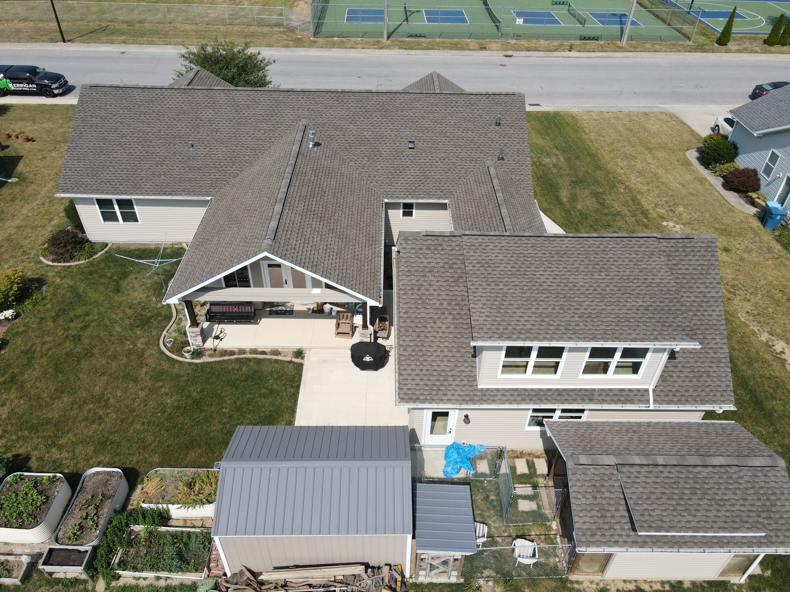 Kerrigan Roofing and Restoration team installing shingles