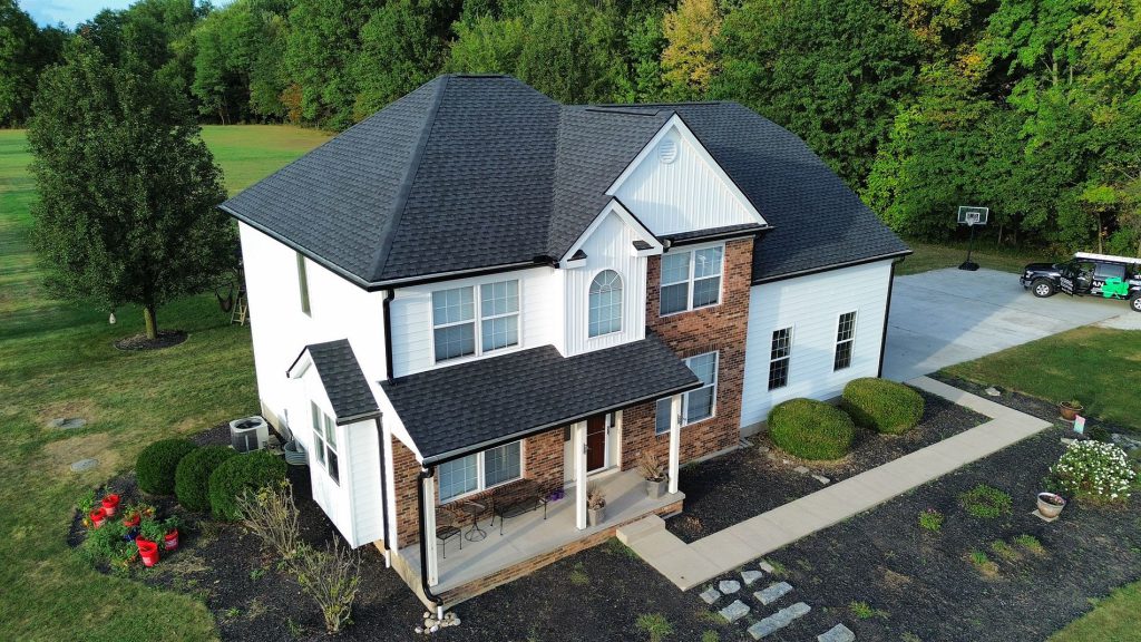 Two-storey home with a dark architectural shingle roof