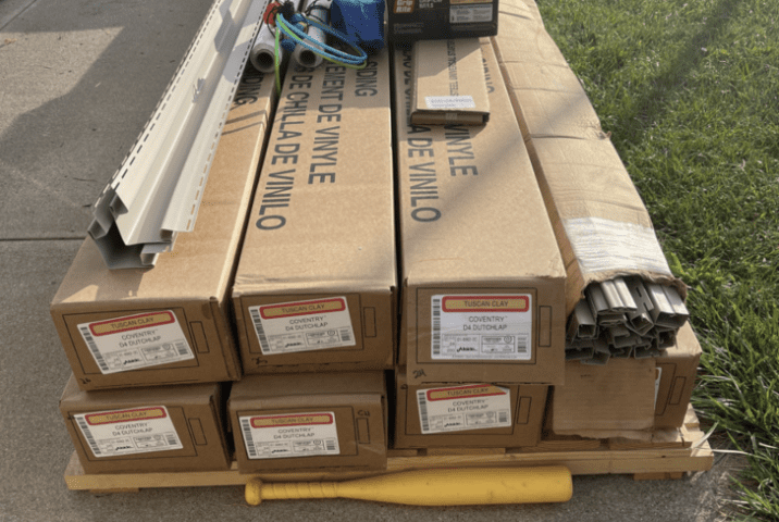 Boxes of new vinyl siding delivered on a pallet