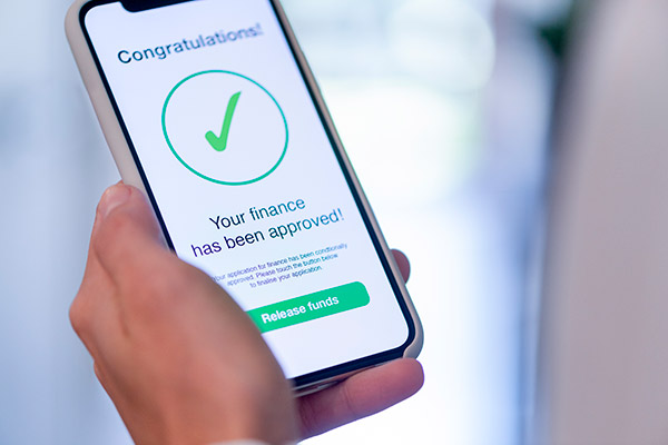 Phone screen showing a finance application approved