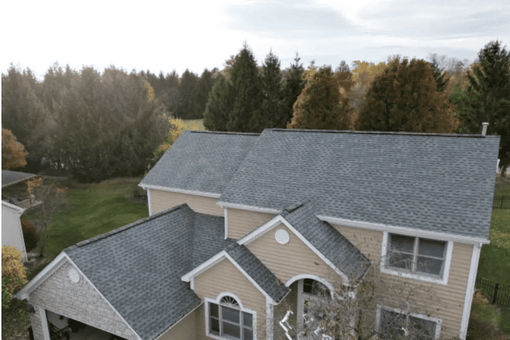 Aerial view of a completed roof and siding project