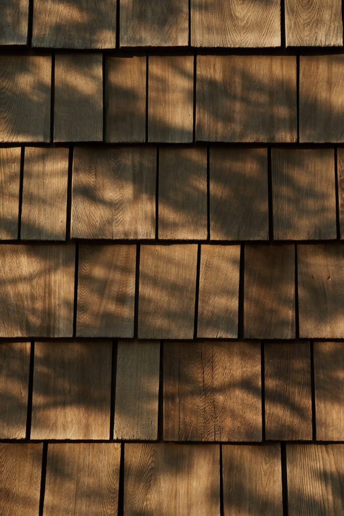Sunlight across a natural cedar shake roof