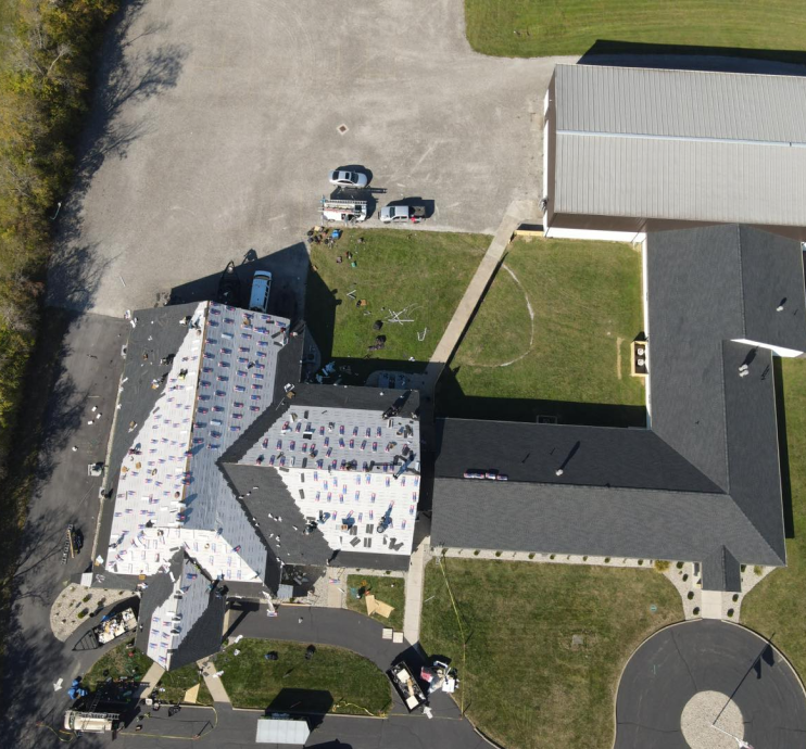 Aerial view of a completed roof replacement